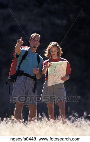 Couple Hiking and Looking at a Map View Large Photo Image Stock Photo - Couple Hiking and Looking at a Map. Fotosearch