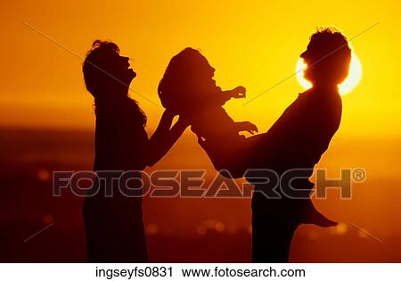 Couple With Child In Sunset View Large Photo Image Stock Image - Couple With Child In Sunset. Fotosearch