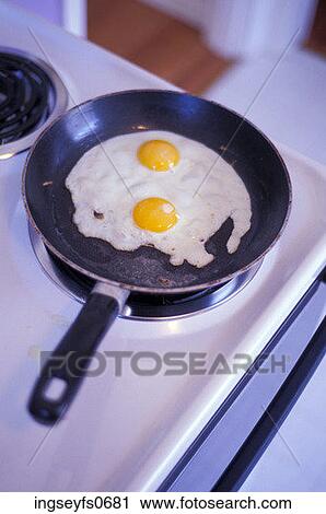 Stock Image - Eggs Frying. Fotosearch