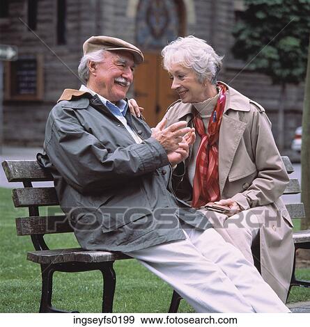 Elderly Couple Sitting On Park Bench And Smiling View Large Photo Image Stock Photo - Elderly Couple Sitting On Park Bench And Smiling. Fotosearch