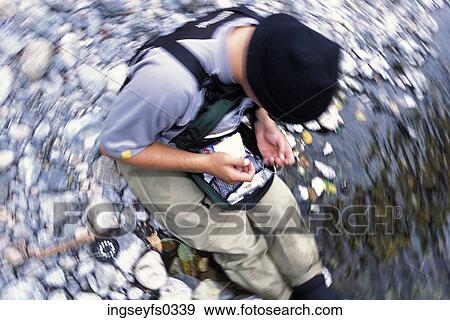Fisherman Baiting A Hook View Large Photo Image Stock Photo - Fisherman Baiting A Hook. Fotosearch