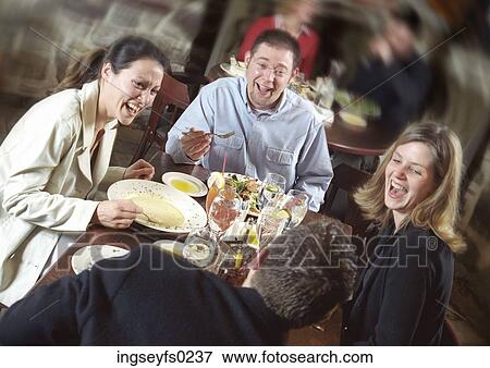 Friends Laughing Over Dinner View Large Photo Image Stock Photo - Friends Laughing Over Dinner. Fotosearch