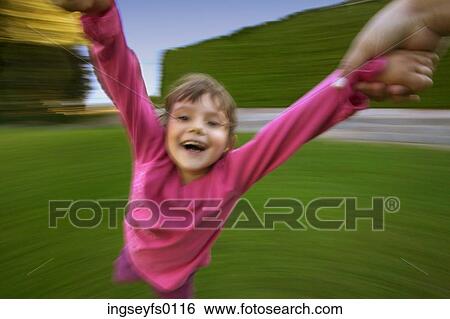 Girl Flying Around The Merry-Go-Round View Large Photo Image Stock Photograph - Girl Flying Around The Merry-Go-Round. Fotosearch