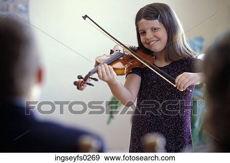 Girl Playing Violin For Parents View Large Photo Image Stock Photo - Girl Playing Violin For Parents. Fotosearch
