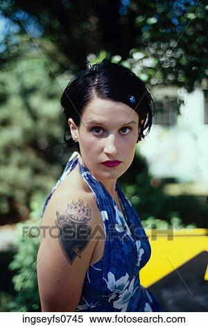 Stock Photography - Girl with Flaming Heart Tattoo. Fotosearch