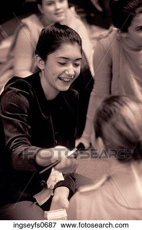 Stock Photo - Girls Giving Makeovers. Fotosearch