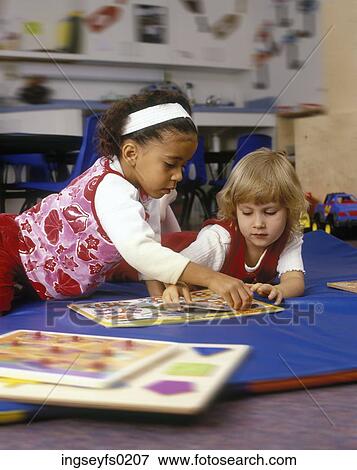 Girls Playing A Game On Classroom Floor View Large Photo Image Stock Photo - Girls Playing A Game On Classroom Floor. Fotosearch
