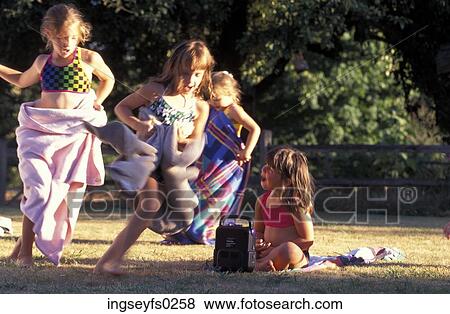 Girls Wearing Swimsuits And Towels And Running In Park View Large Photo Image Stock Photo - Girls Wearing Swimsuits And Towels And Running In Park. Fotosearch