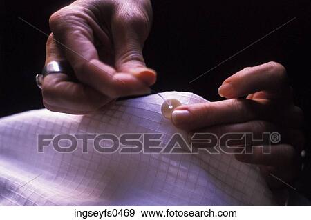 Hands Sewing on a Button View Large Photo Image Stock Photo - Hands Sewing on a Button. Fotosearch