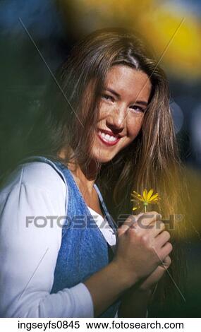Stock Photography - Happy Girl With Flower. Fotosearch