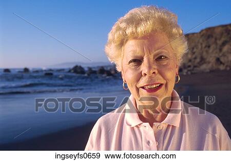 Happy Senior Lady at the Beach View Large Photo Image Stock Photo - Happy Senior Lady at the Beach. Fotosearch