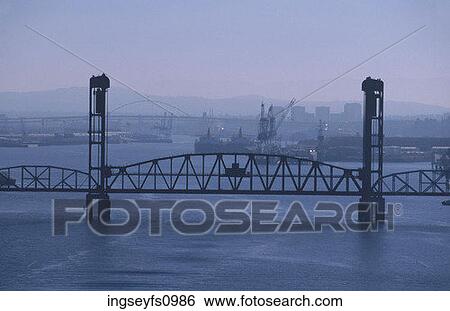 Stock Photograph - Industrial Bridge over River. Fotosearch