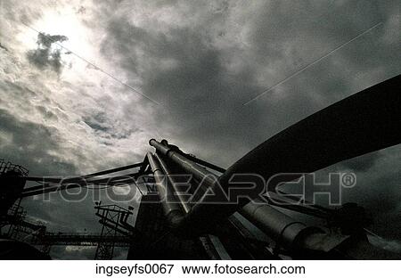 Industrial Structures Under A Dark Gray Sky View Large Photo Image Stock Photo - Industrial Structures Under A Dark Gray Sky. Fotosearch