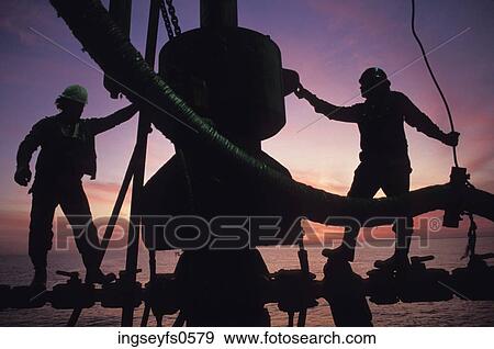 Industrial Workers on an Oil Rig View Large Photo Image Stock Photo - Industrial Workers on an Oil Rig. Fotosearch