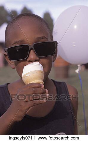 Kid in Rad Sunglasses Eating Ice Cream View Large Photo Image Stock Image - Kid in Rad Sunglasses Eating Ice Cream. Fotosearch