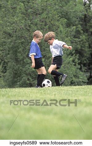 Little Boys Playing Soccer View Large Photo Image Stock Photo - Little Boys Playing Soccer. Fotosearch