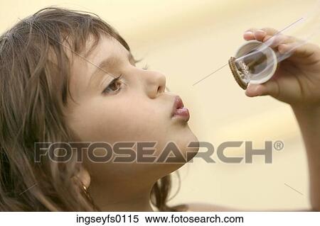 Little Girl Blowing Soap Bubbles View Large Photo Image Stock Photography - Little Girl Blowing Soap Bubbles. Fotosearch