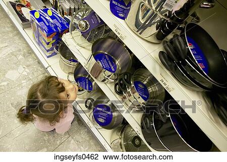Little Girl Looking at Pots and Pans in a Store View Large Photo Image Stock Image - Little Girl Looking at Pots and Pans in a Store. Fotosearch