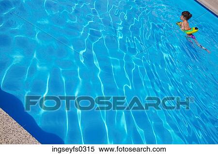 Stock Photography - Little Girl Swimming In Pool. Fotosearch