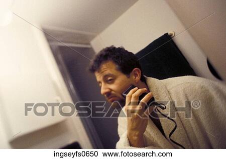 Man Shaving with Electric Razor View Large Photo Image Stock Image - Man Shaving with Electric Razor. Fotosearch