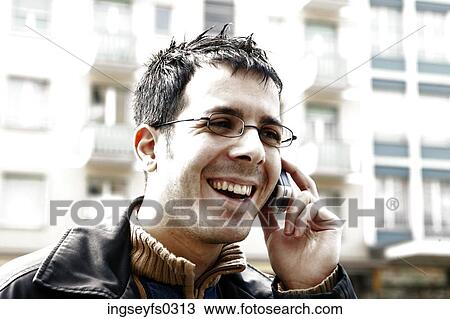 Stock Image - Man Talking On Cell Phone. Fotosearch
