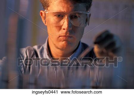 Stock Image - Man Working in Chemistry Lab. Fotosearch