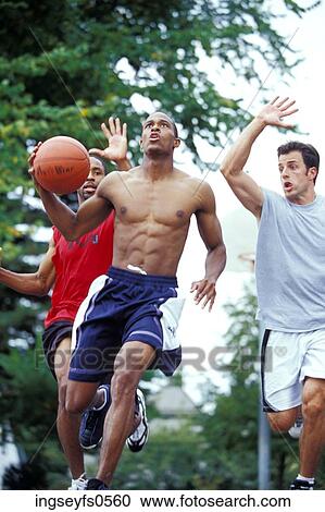 Stock Image - Men Playing Basketball. Fotosearch