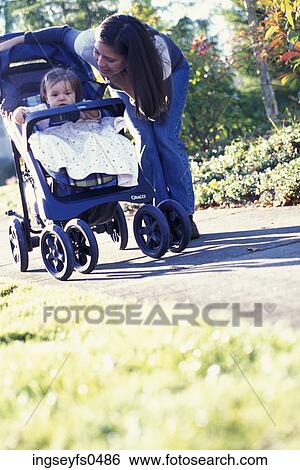 Mother With Baby Girl in Stroller View Large Photo Image Stock Photograph - Mother With Baby Girl in Stroller. Fotosearch