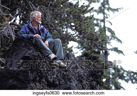 Older Man Sitting on a Rock View Large Photo Image Stock Image - Older Man Sitting on a Rock. Fotosearch