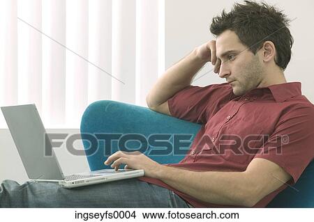 Pensive Guy with Laptop View Large Photo Image Picture - Pensive Guy with Laptop. Fotosearch