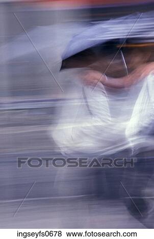 People in Motion with Umbrellas View Large Photo Image Stock Photo - People in Motion with Umbrellas. Fotosearch