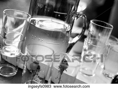 Stock Image - Pitcher of Water and Glasses. Fotosearch