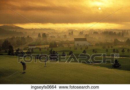 Playing Golf at Sunset View Large Photo Image Picture - Playing Golf at Sunset. Fotosearch