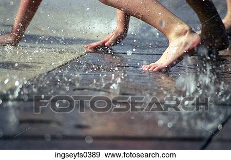 Stock Photo - Playing in Fountain. Fotosearch