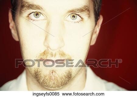 Portrait Of A Caucasian Man Looking Into A Bright Light View Large Photo Image Stock Photography - Portrait Of A Caucasian Man Looking Into A Bright Light. Fotosearch