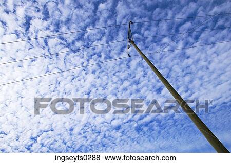Power Lines Against Cloudy Sky View Large Photo Image Stock Photo - Power Lines Against Cloudy Sky. Fotosearch