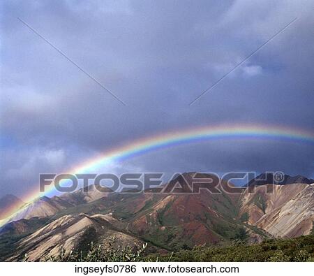 Stock Photograph - Rainbow Over the Mountains. Fotosearch