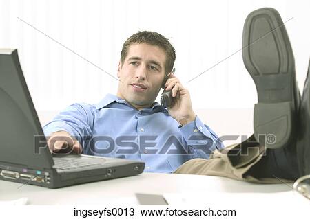 Relaxed Man in Blue Shirt with Laptop View Large Photo Image Stock Image - Relaxed Man in Blue Shirt with Laptop. Fotosearch