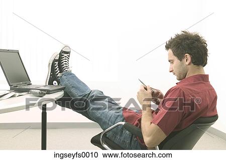 Relaxed Man with Feet on Computer Desk View Large Photo Image Stock Image - Relaxed Man with Feet on Computer Desk. Fotosearch