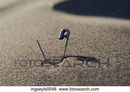 Safety Pin Stuck In The Carpet View Large Photo Image Stock Photo - Safety Pin Stuck In The Carpet. Fotosearch