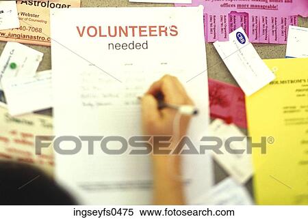 Stock Photography - Signing a Volunteers Needed List. Fotosearch
