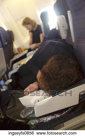 Sleeping On Airplane View Large Photo Image Stock Photograph - Sleeping On Airplane. Fotosearch