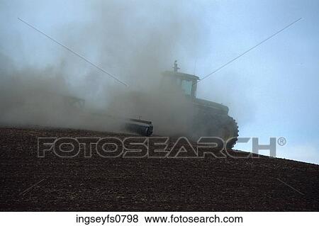 Tractor in Dusty Field View Large Photo Image Stock Photo - Tractor in Dusty Field. Fotosearch