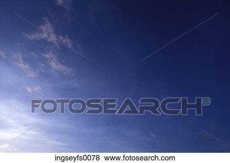 Wispy Pink Clouds In A Dark Blue Sky View Large Photo Image Stock Photo - Wispy Pink Clouds In A Dark Blue Sky. Fotosearch