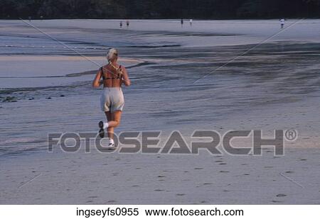 Woman Jogging on Beach View Large Photo Image Stock Photography - Woman Jogging on Beach. Fotosearch