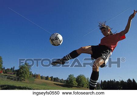 Woman Kicking Soccer Ball View Large Photo Image Stock Image - Woman Kicking Soccer Ball. Fotosearch