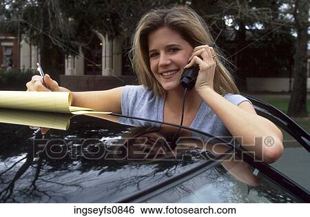 Woman On Cell Phone With Car View Large Photo Image Stock Photograph - Woman On Cell Phone With Car. Fotosearch