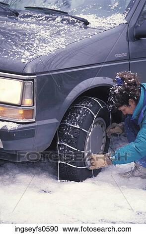 Woman Putting Chains on a Tire View Large Photo Image Stock Image - Woman Putting Chains on a Tire. Fotosearch