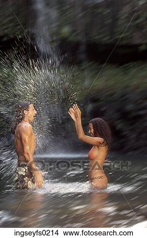 Woman Splashing Man In Tropical Pool View Large Photo Image Picture - Woman Splashing Man In Tropical Pool. Fotosearch
