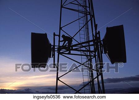 Stock Photograph - Working on a Microwave Tower. Fotosearch